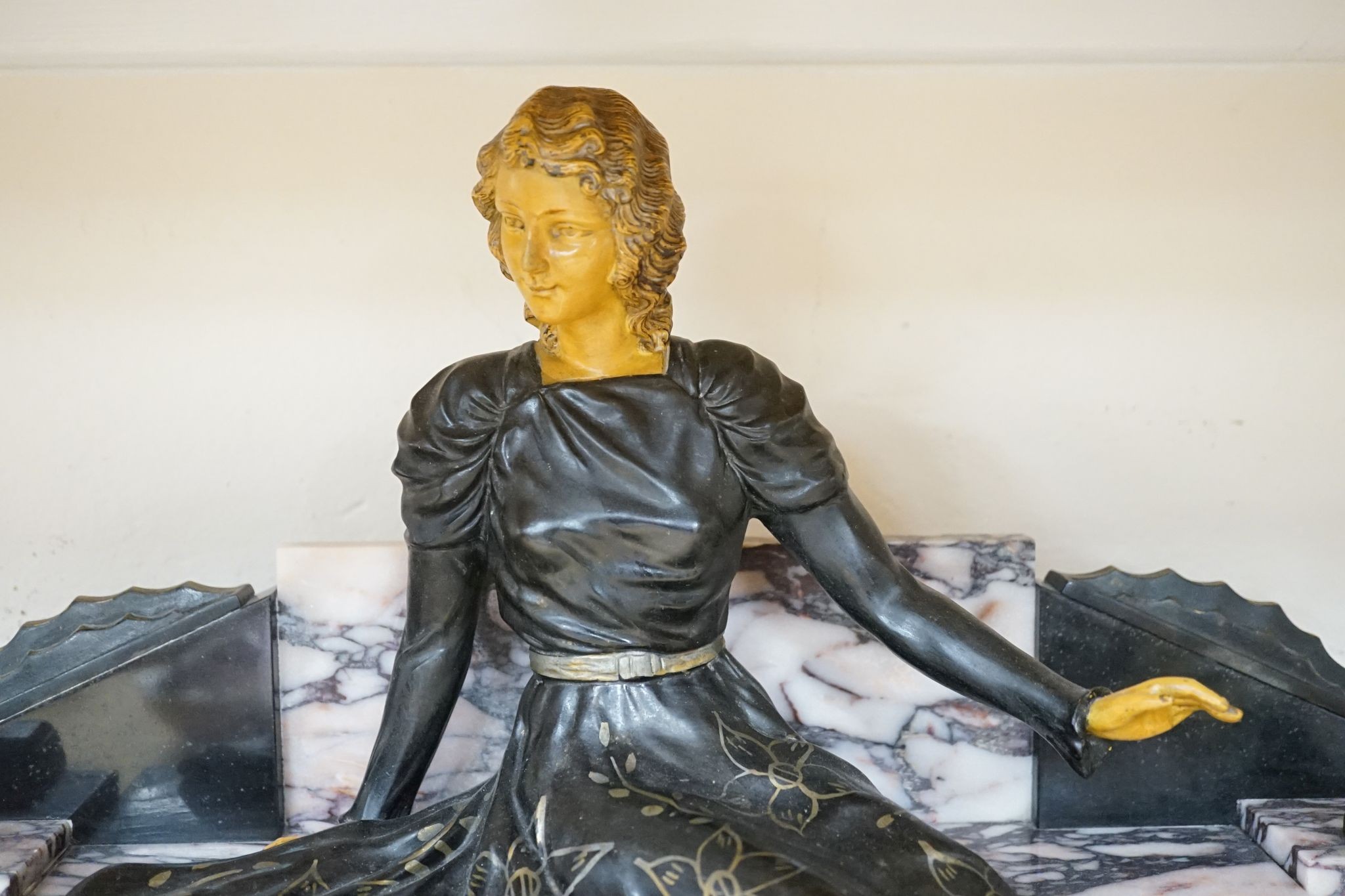 A large Art Deco style marble and spelter figural mantel ornament, 74 cms wide.